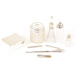 A collection of silver dressing table items.