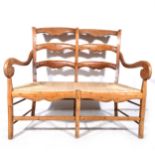 A teak twin-back two seat chair/ bench