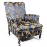 An upholstered Edwardian arm chair