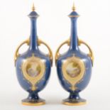 A pair of Royal Worcester ornamental bottle vases and covers