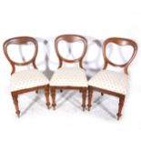 Three spoon-back dining chairs