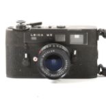Leica M5 black rangefinder camera, with Leitz Wetslar 1:3.4/21 lens, serial number 1350756, in
