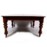 A Victorian mahogany fixed top dining table