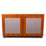 A contemporary cherry wood speaker cabinet