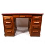 An oak twin pedestal desk