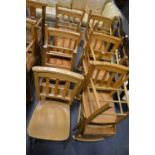 A set of eleven beech and mixed wood Chapel chairs