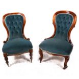 A Victorian mahogany spoon-back nursing chair, and another similar