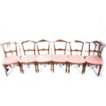 A set of six Victorian walnut drawing-room chairs