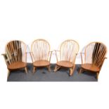 Three Ercol armchairs and similar rocking chair