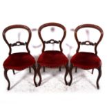 A VIctorian figured walnut loo table, and a set of four balloon-back chairs