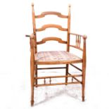 An Arts & Crafts style stained beechwood ladder-back dining chair