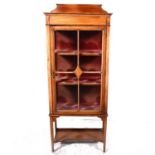 An Edwardian inlaid mahogany china cabinet