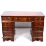 A Victorian style mahogany twin pedestal desk