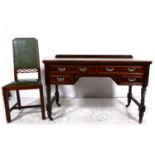 A Victorian walnut desk table, and a high-backed chair