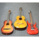 Ibanez EX series electric guitar, red, a small Torque guitar amp, and two acustic guitars.