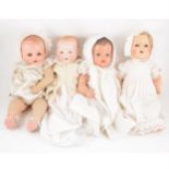 Four baby dolls including Armand Marseille Germany bisque head baby doll and three composition head