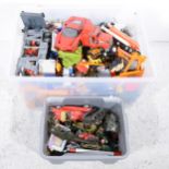 Two tubs of plastic and metal toy vehicles and cars.