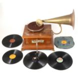 Leophone gramophone record player, with horn, handle and side glass panels.
