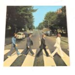 The Beatles Abbey Road LP vinyl record; Stereo PCS 7088 matrix 749-2/750-1, misaligned apple label,