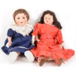 Two composition dolls; both unmarked composition heads, one with leather body.