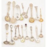 Eighteen decorative and novelty silver salt spoons.
