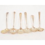 Six small silver sugar sifting spoons.