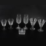 Eight Waterford Crystal wine glasses, six sherry glasses, and other stemware.