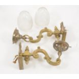 A pair of brass wall lights,