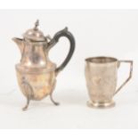 A small silver hot water jug and a sterling silver mug,