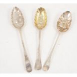 Three Georgian silver berry spoons with later decoration.