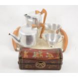 Picquot ware four-piece teaset on a matching tray