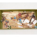 A collection of bone and wooden pillow lace bobbins, hooks etc.