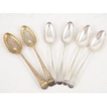 A pair of silver gilt spoons and two other pair of spoons,