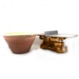 A set of G.P.O. postal scales and a large ceramic mixing bowl.