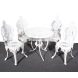 A white painted metal patio table and four chairs