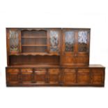 A reproduction stained oak dresser with leaded glazed cupboards, and similar side cabinet/ bookcase