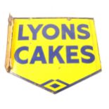 A vintage enamel double-sided shop sign for Lyons Cakes.