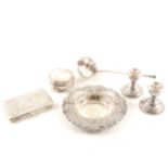 A quantity of silver items, including an Edwardian silver cased purse, bowl, dwarf candlesticks etc.