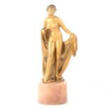 A gilt and cold-painted spelter Art Deco sculpture of a bather