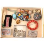 Polished stone and other brooches, bags of loose stones etc.