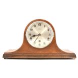 A 1940s oak mantel clock,