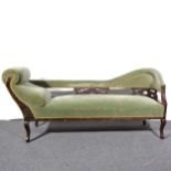 An Edwardian stained beechwood scroll end chaise longue,