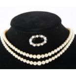 A cultured pearl two row necklace and pearl set brooch.