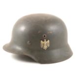 WWII German steel war helmet with side decals.