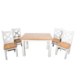A modern extending oak and painted kitchen table and six chairs