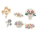A collection of vintage coloured floral design paste brooches.