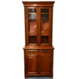 An Edwardian walnut glazed bookcase