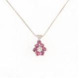 A ruby and diamond pendant and chain.