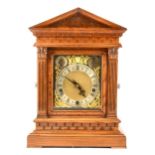 A late Victorian oak mantel clock