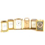 Six assorted brass cased carriage clocks and a Bakelite cased thermometer